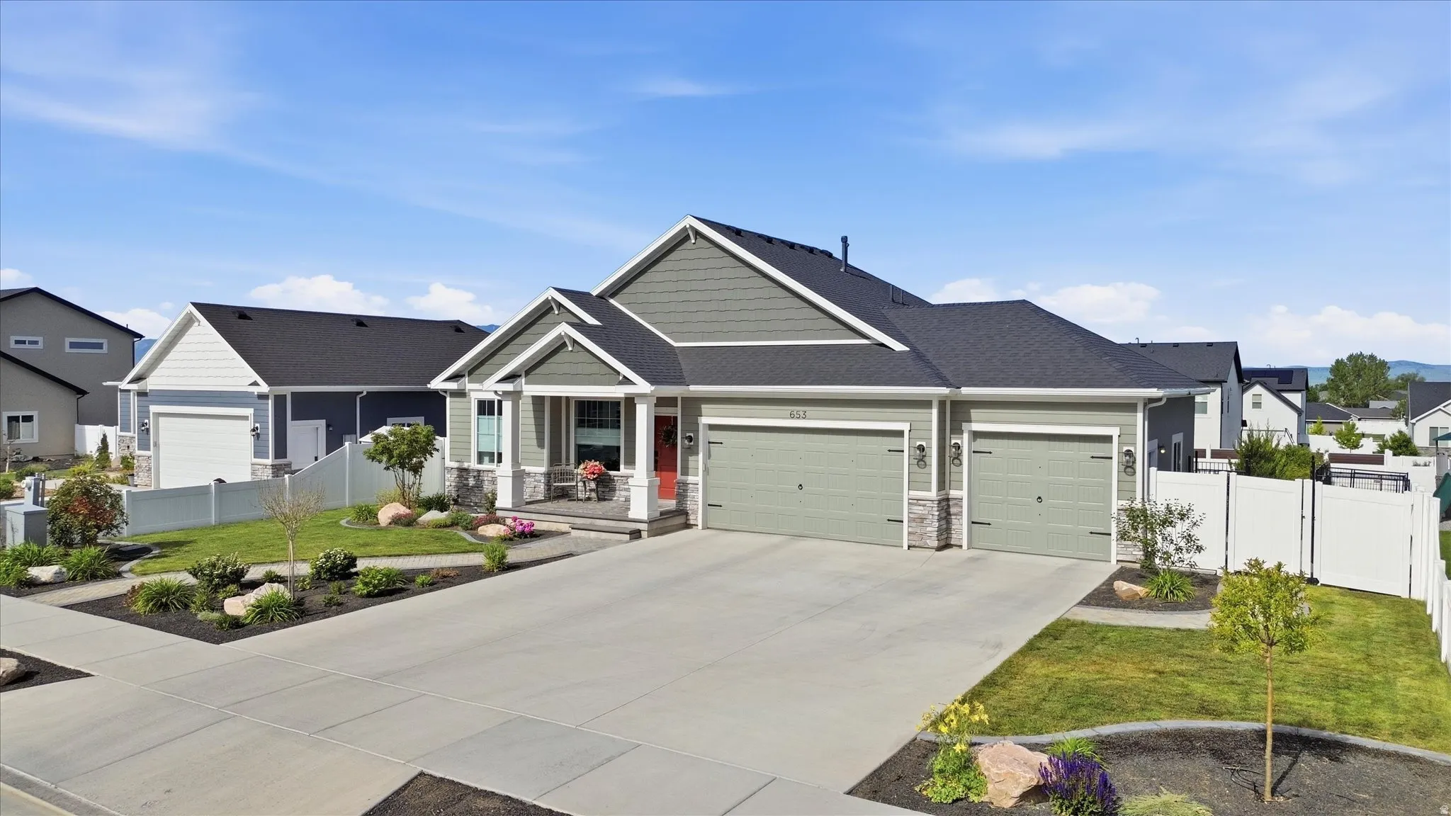 Siding exterior with stone accents and a covered front porch