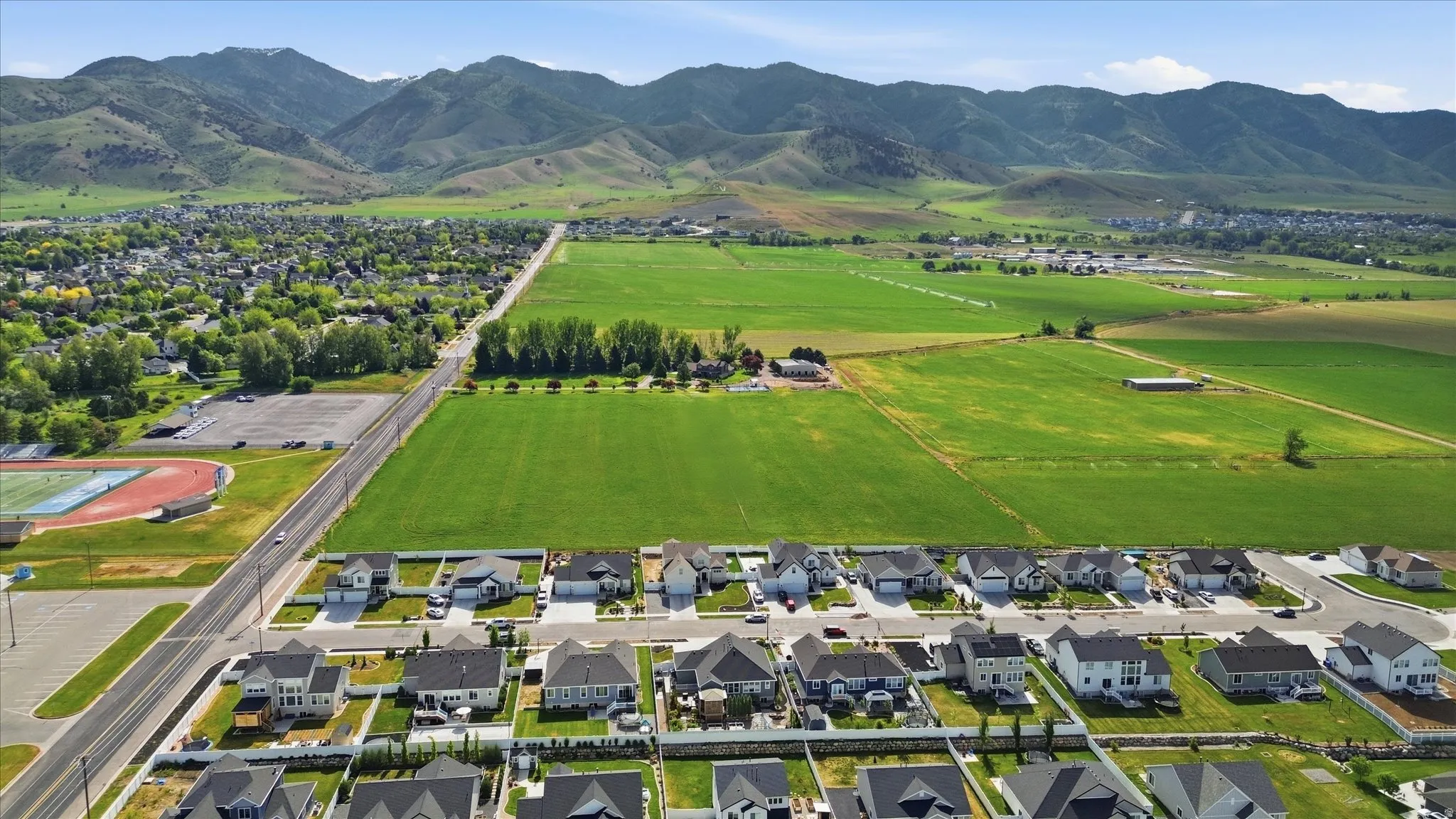 Residential development featuring single-family homes with mountain backdrops