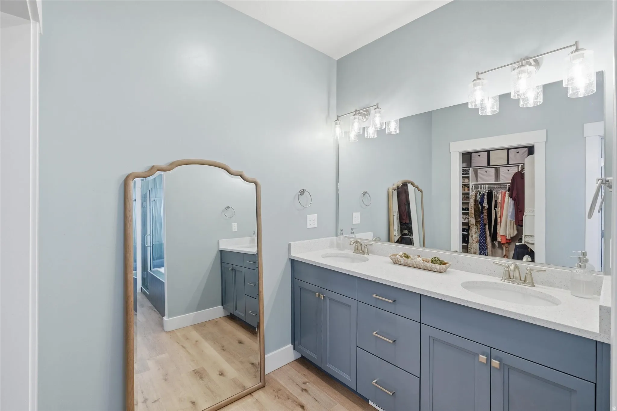 Dual vanity with stone-finish countertop and undermount sinks