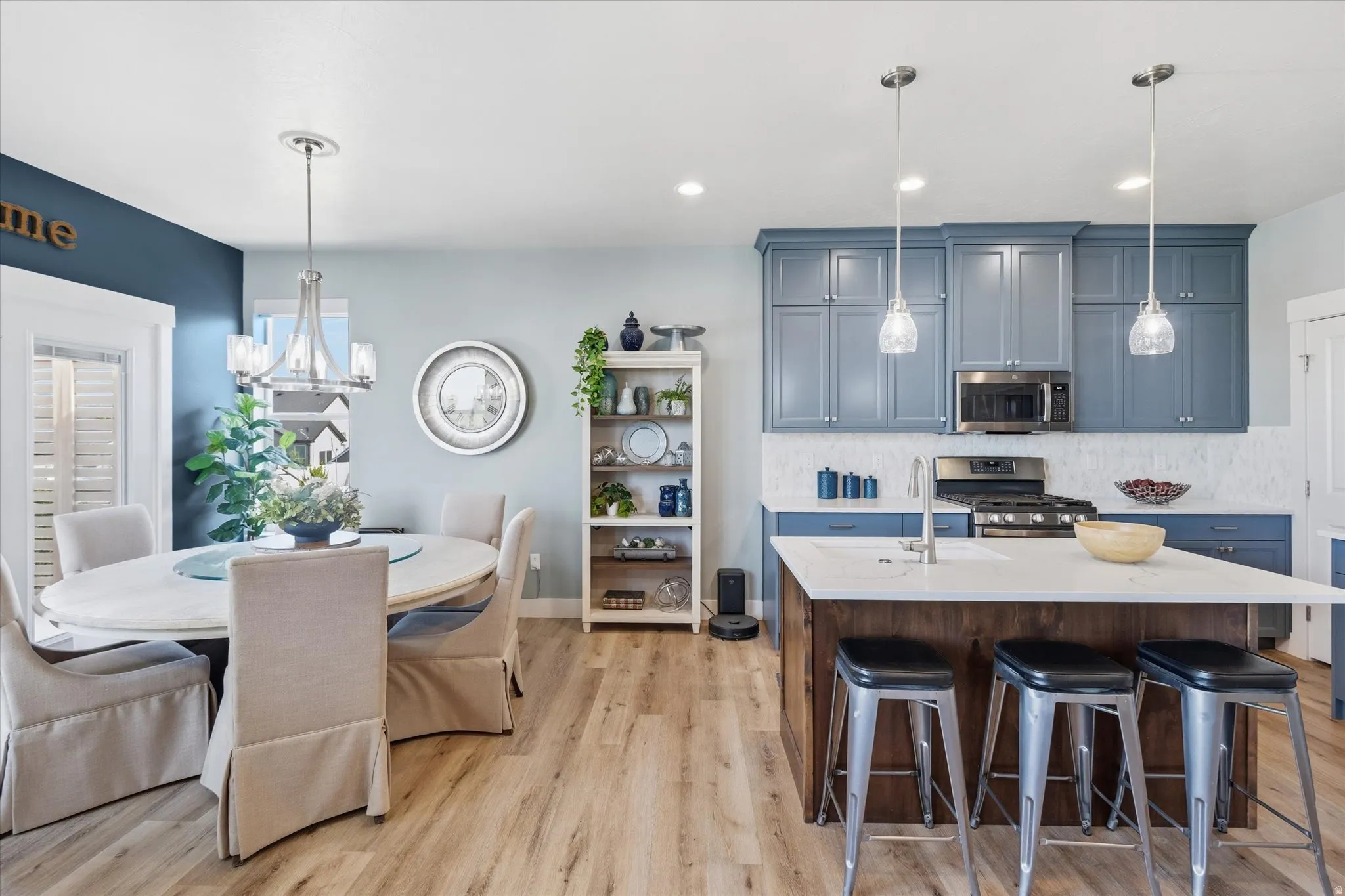 Kitchen and dining area featuring wood-finish flooring