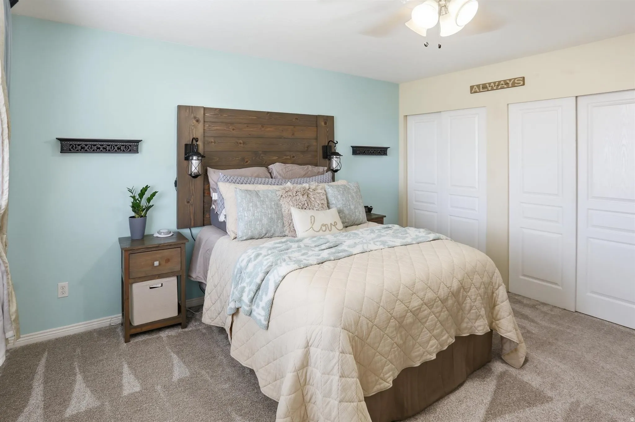 Primary bedroom Wood-finish headboard with integrated sconce lighting, new carpet