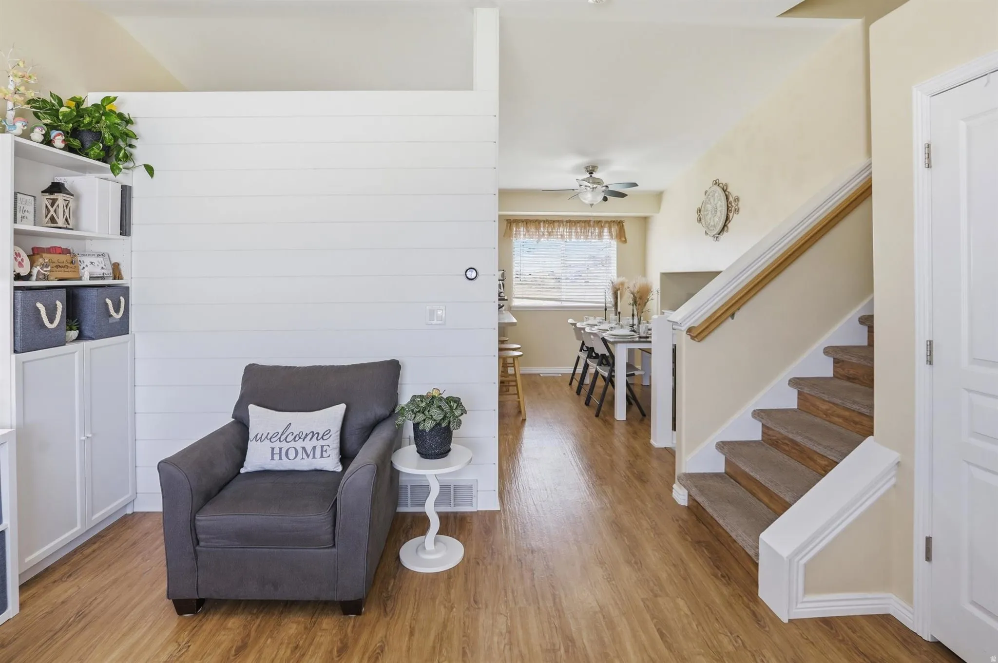 Open concept living area featuring wood-finish flooring