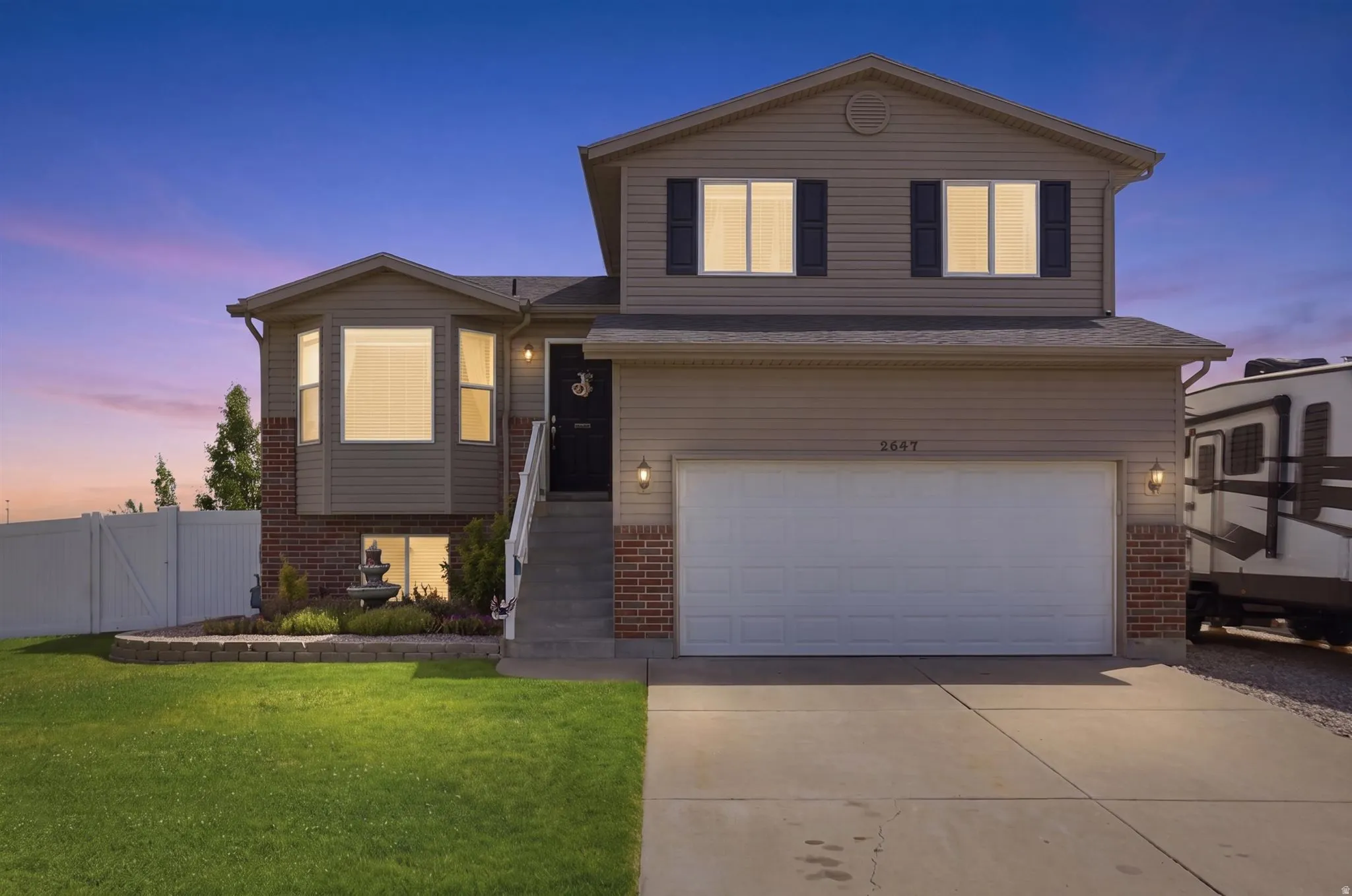 Sunset photo of exterior of home. Really beautiful!