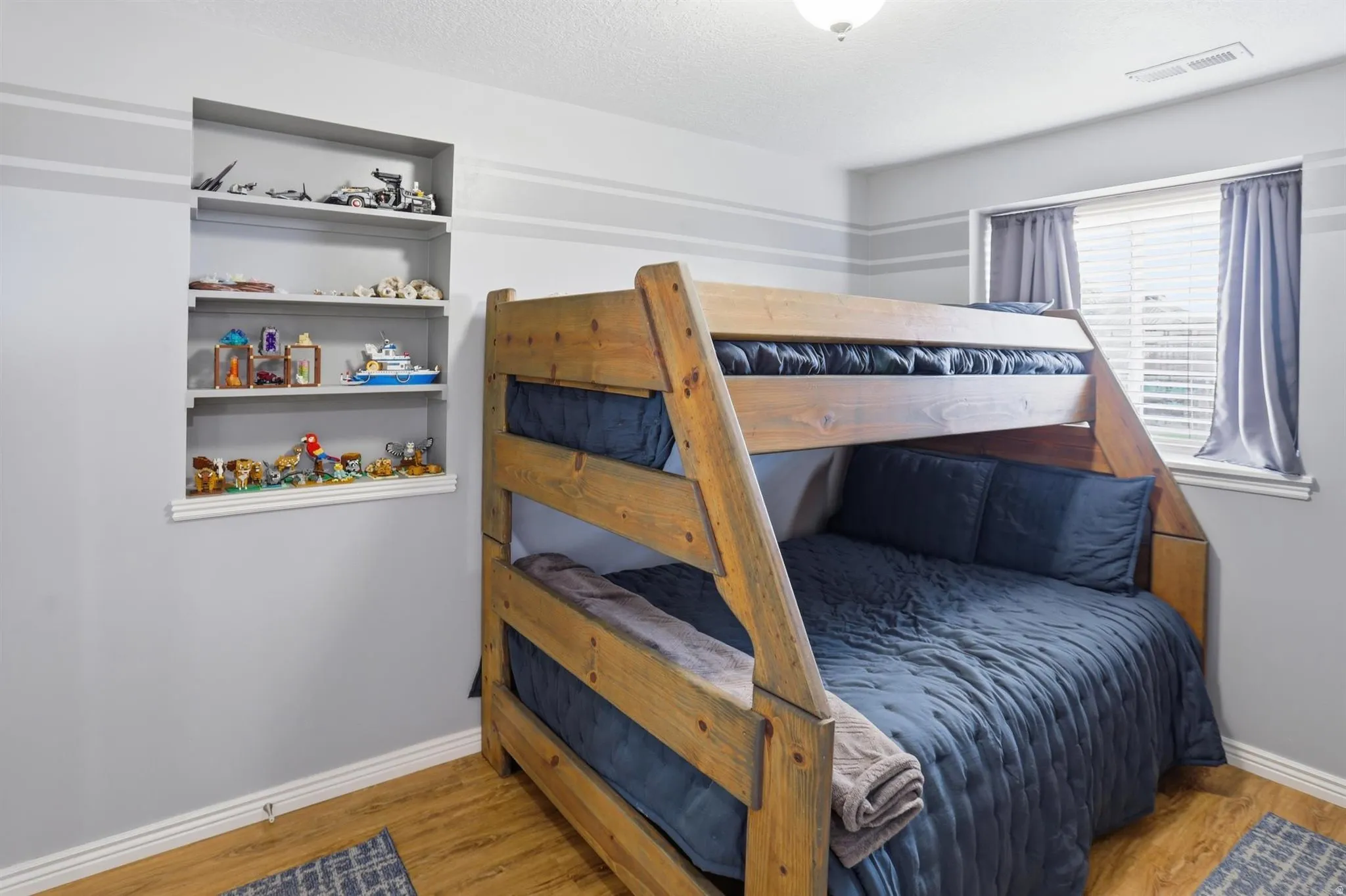 Basement Bedroom #4 Recessed wall shelving provides storage