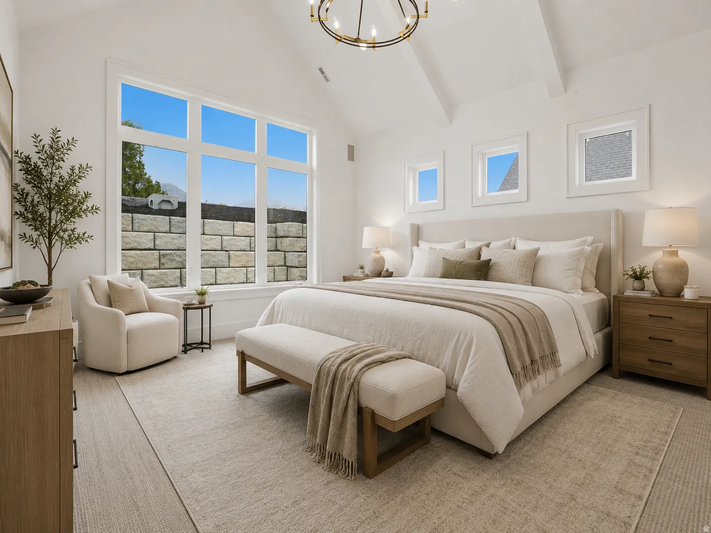 Spacious room featuring a prominent vaulted ceiling with exposed beams, large picture windows, wood-finish flooring, and additional square accent windows