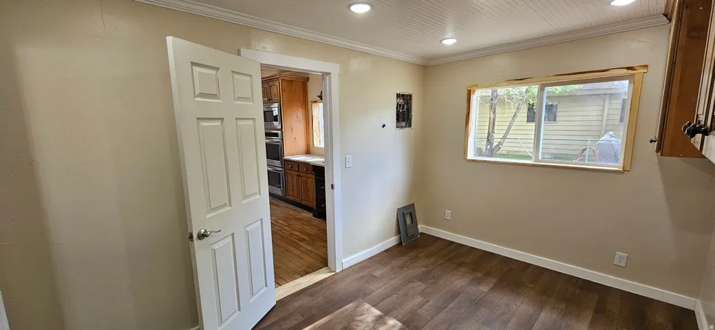 Interior space featuring wood-finish flooring, recessed lighting, and a beadboard ceiling