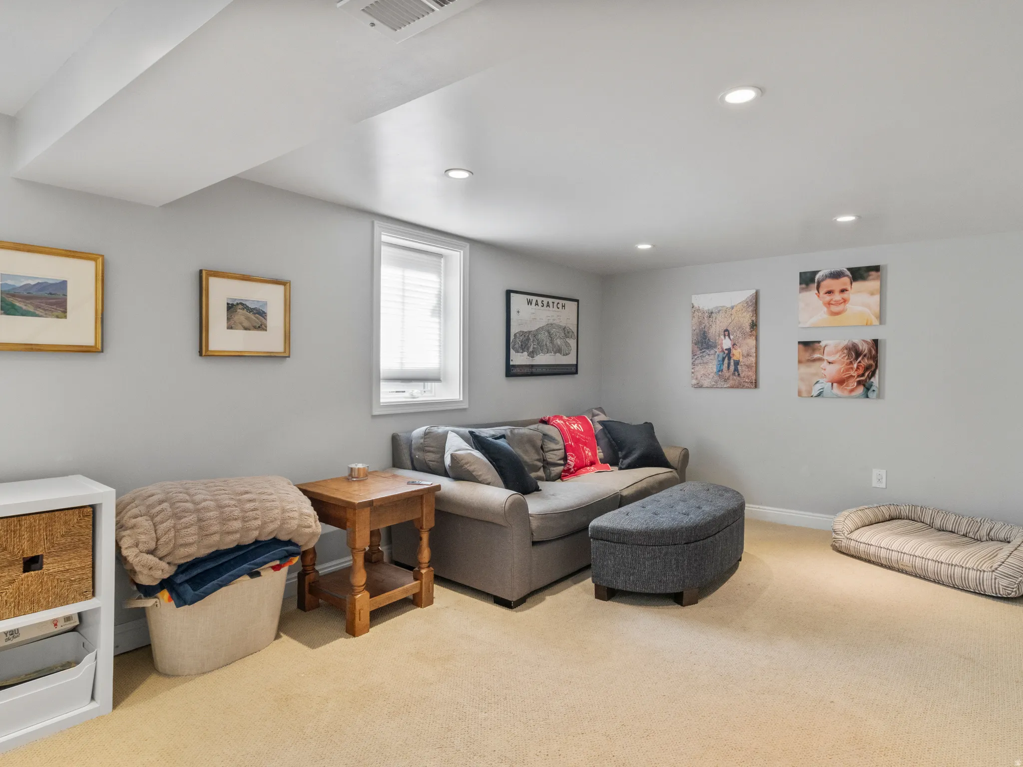 Finished room featuring recessed lighting, a window with blinds, light-toned carpeting, and light gray wall paint