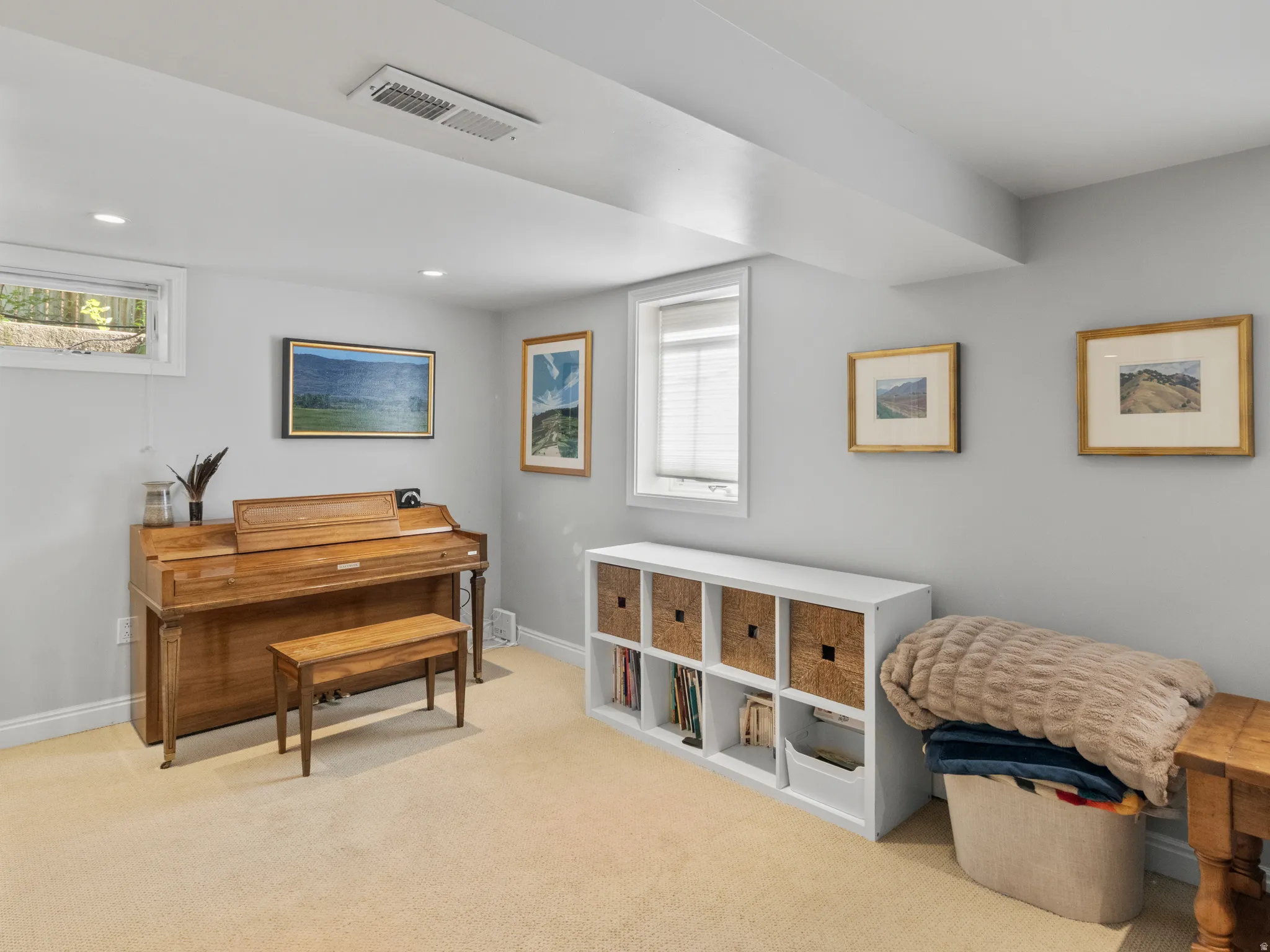 Carpeted room featuring recessed lighting, a window with blinds, and light gray walls