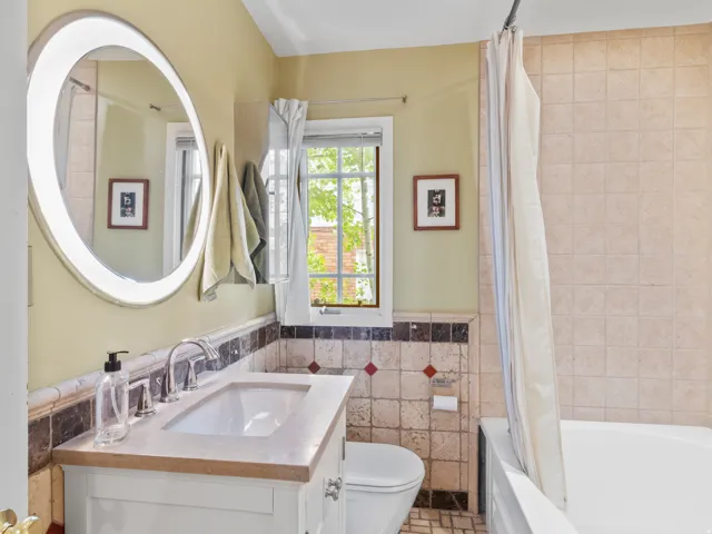 Bathroom featuring a vanity with an integrated sink and polished chrome faucet