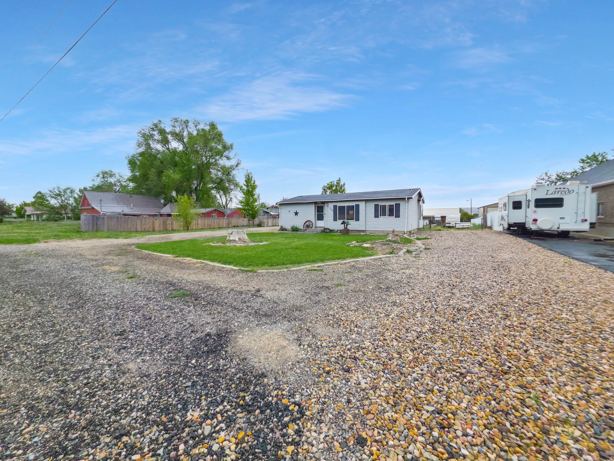 Spacious gravel driveway offering ample parking