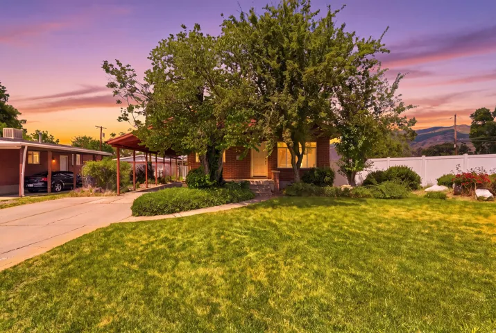 Brick Rambler with Mature trees and covered carport