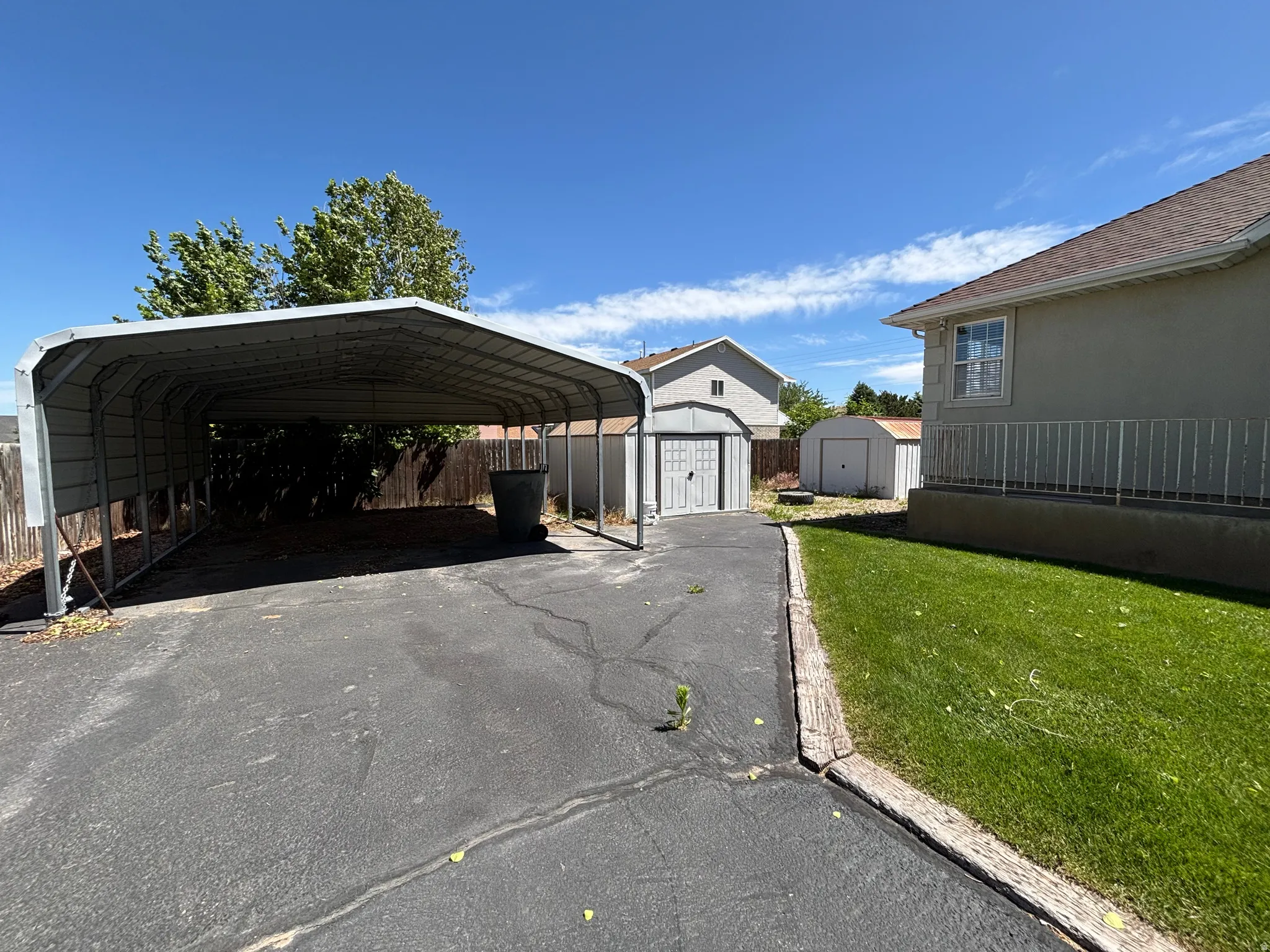 Gable roof carport providing covered parking