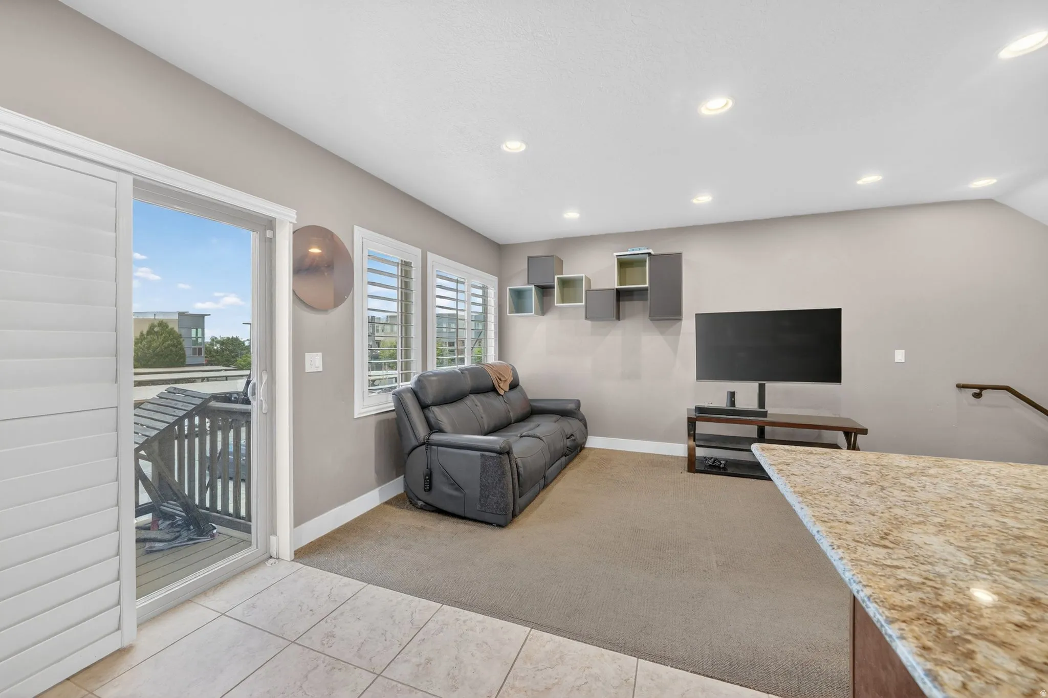 Living space featuring a sliding glass door to an exterior balcony