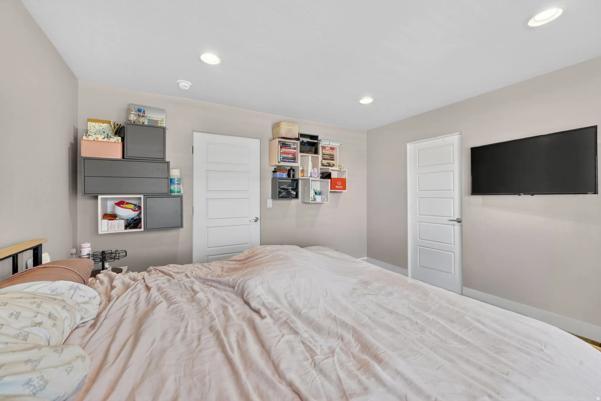 Interior room featuring light neutral walls and recessed ceiling lighting