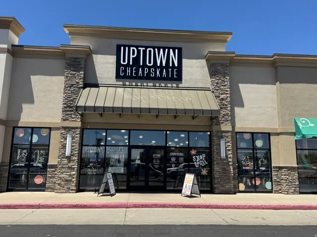 Commercial storefront featuring a stone veneer facade and a large illuminated sign