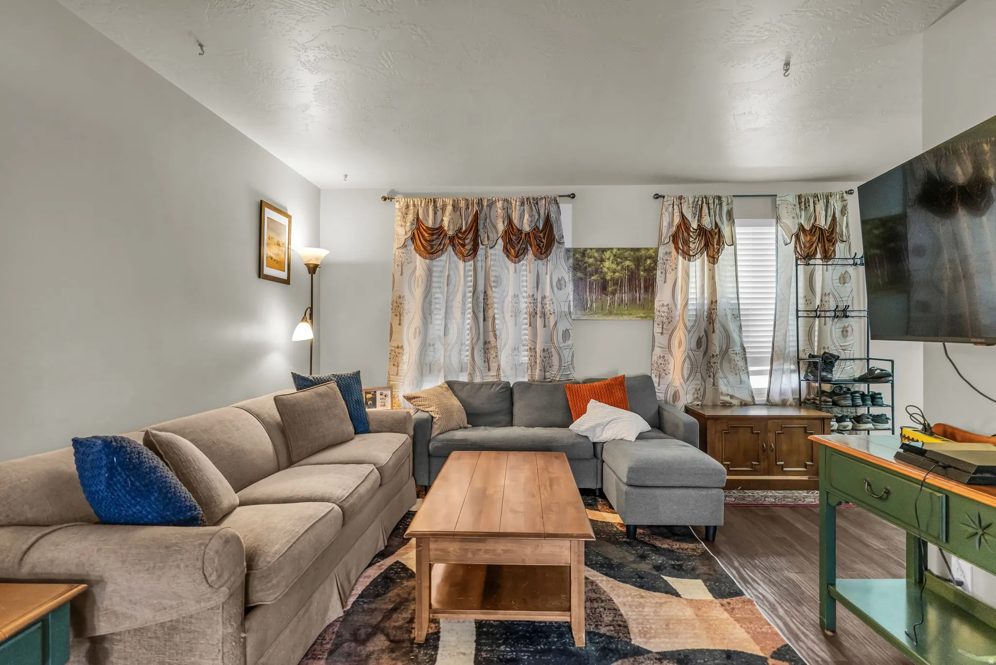 Living space featuring wood-finish flooring and light-toned walls