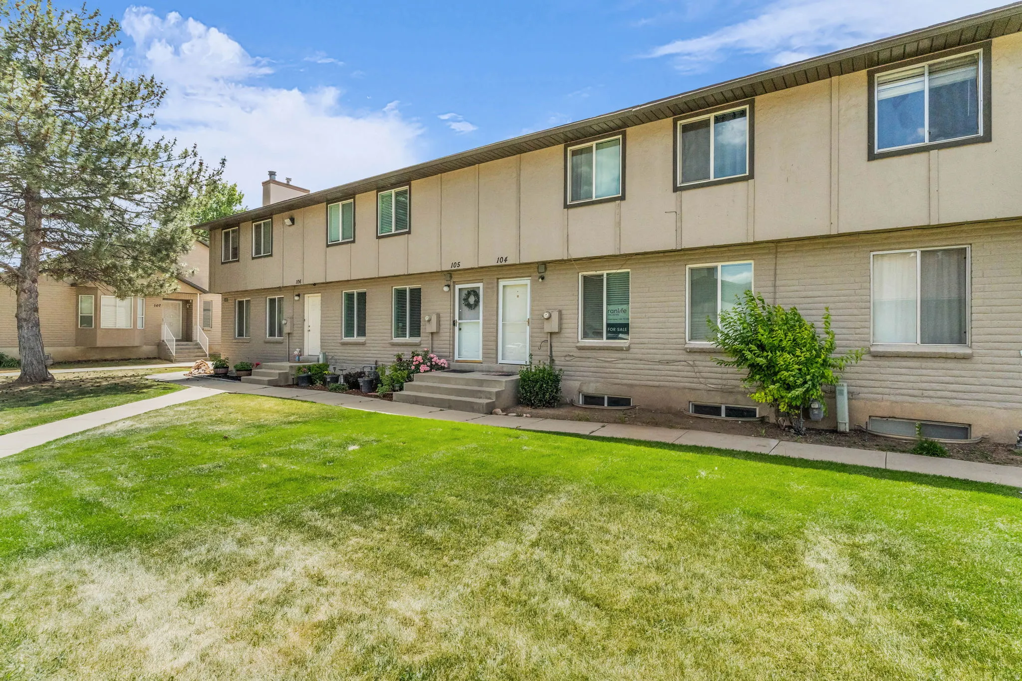 Multi-unit property with a brick and panel exterior