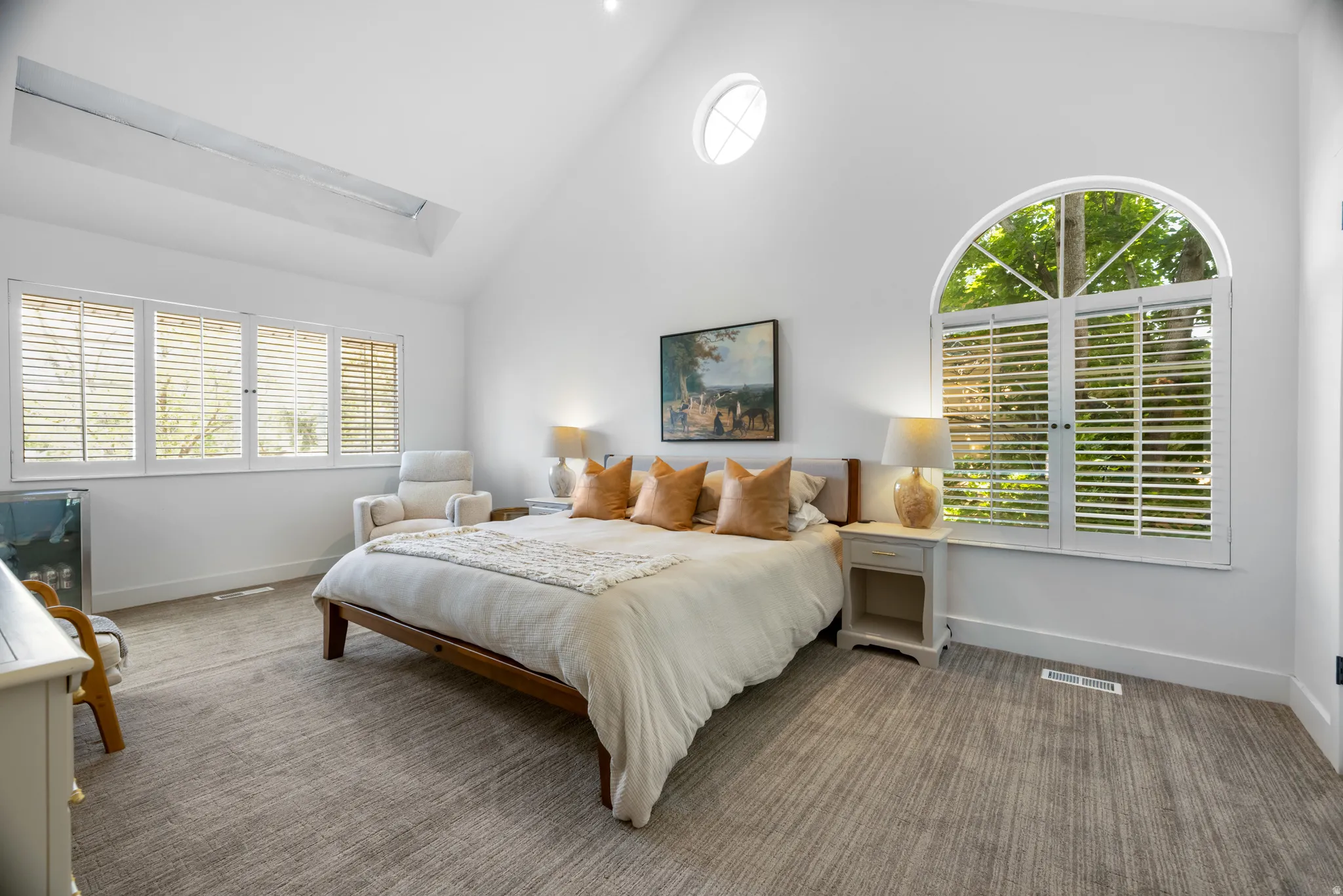 Vaulted ceiling with skylight and round window
