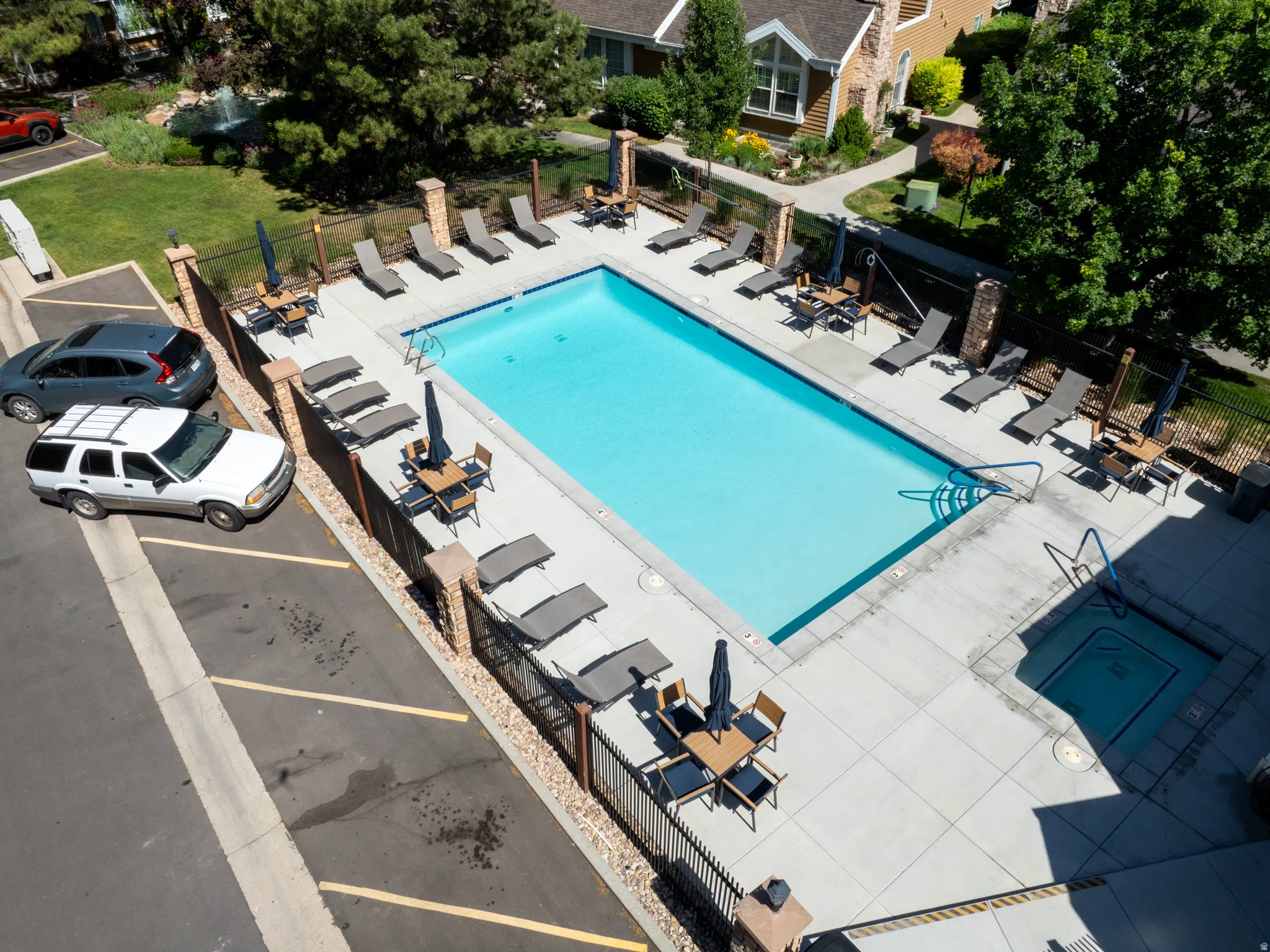 Rectangular swimming pool surrounded by a concrete deck