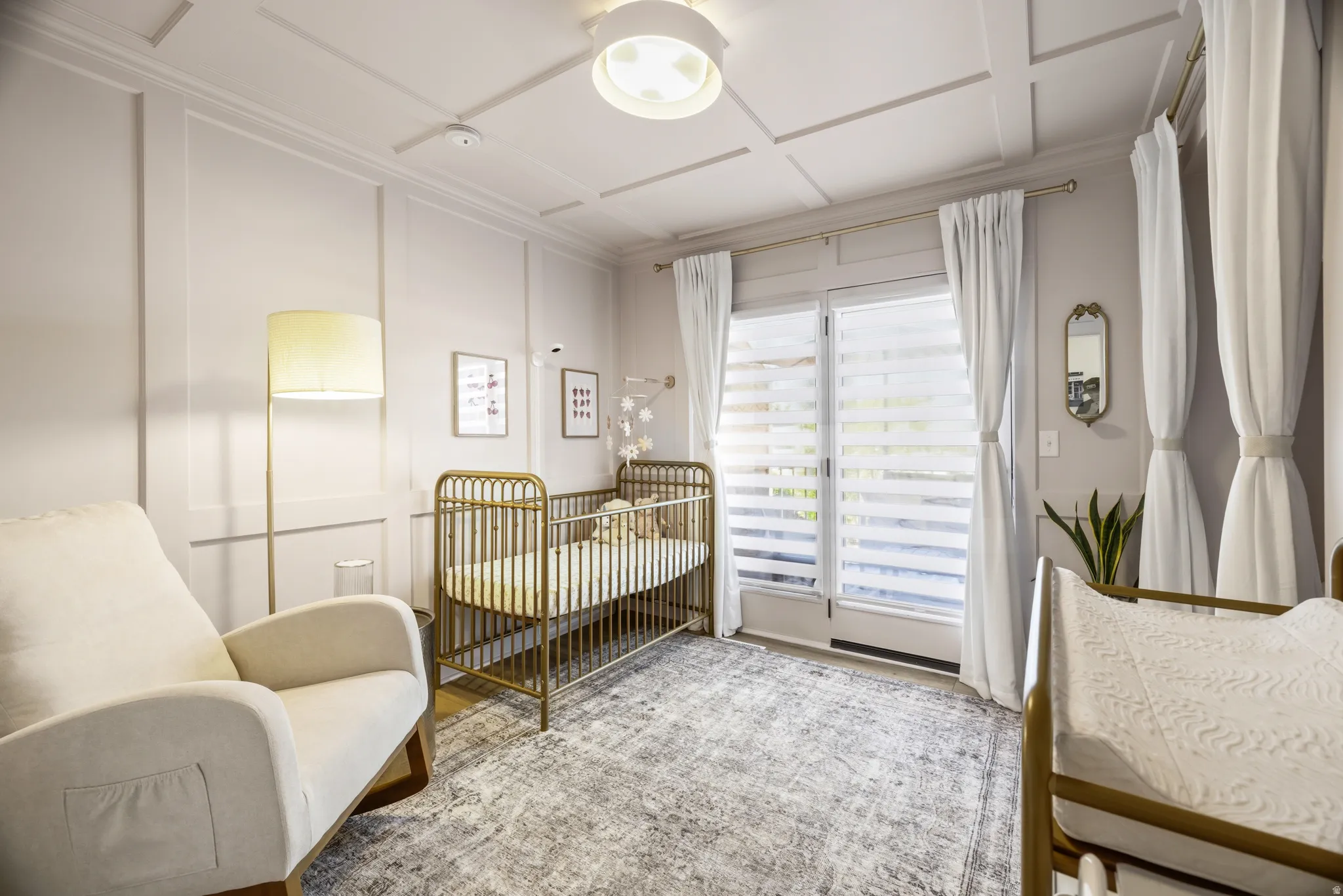 Room featuring wainscoting and a coffered ceiling