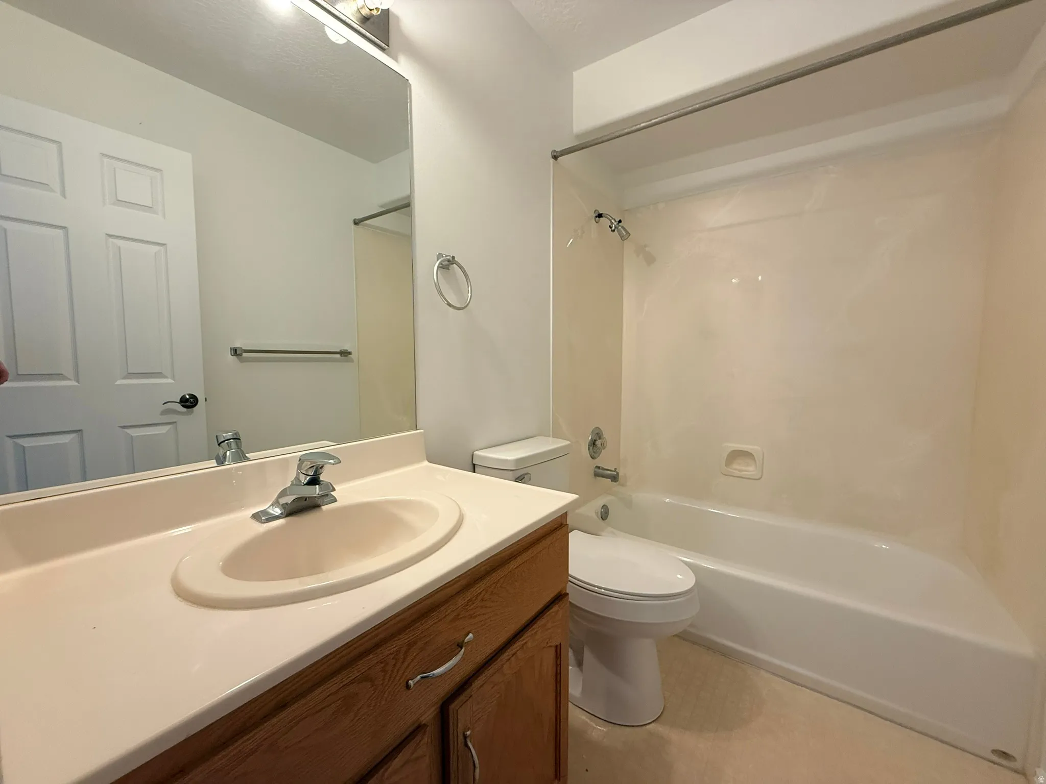 Bathroom vanity with an integrated sink and wood-finish cabinetry