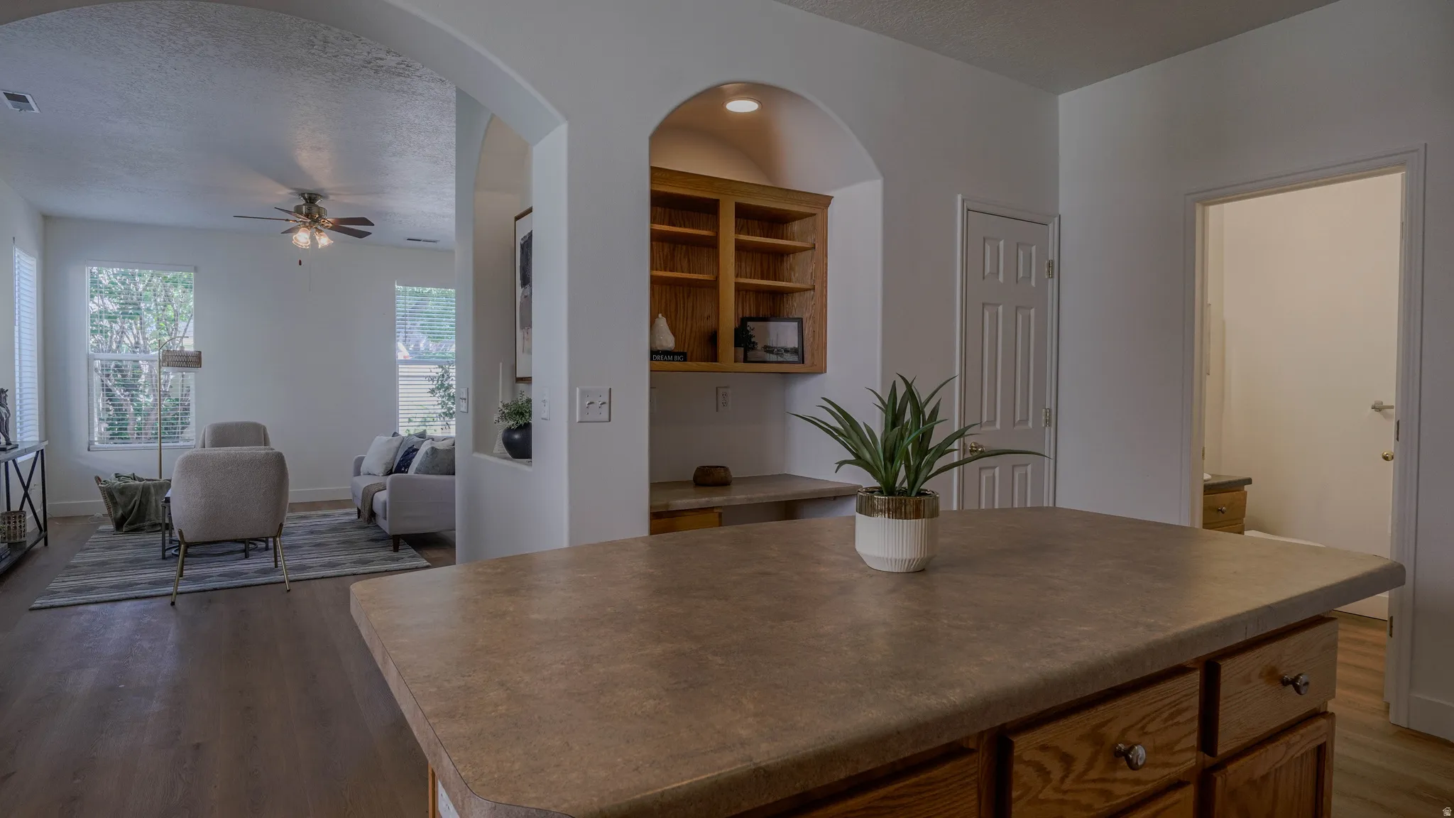 Kitchen island with a durable countertop and wood-finish cabinetry