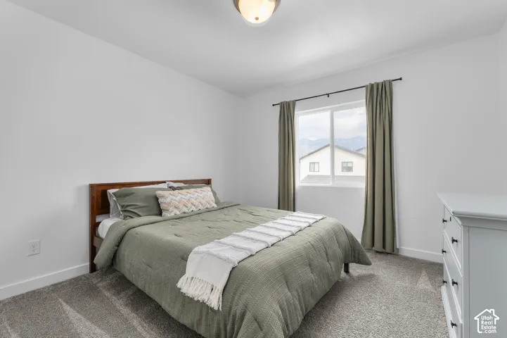 Bedroom featuring carpet flooring and white walls