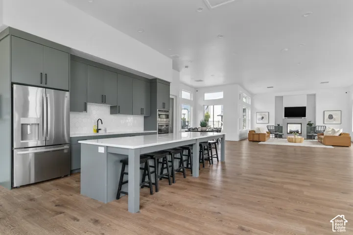 Open-concept living space with wood-finish flooring