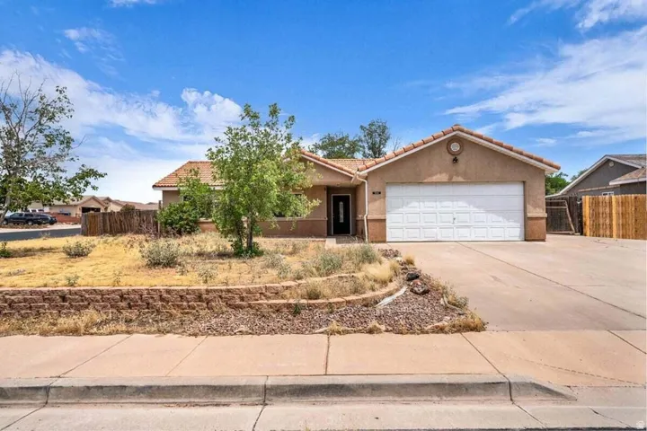 Southwestern-style stucco exterior with a terra cotta tile roof