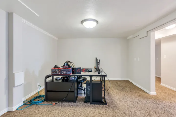 Apartment Living room with neutral walls, carpet, white baseboards, and crown molding
