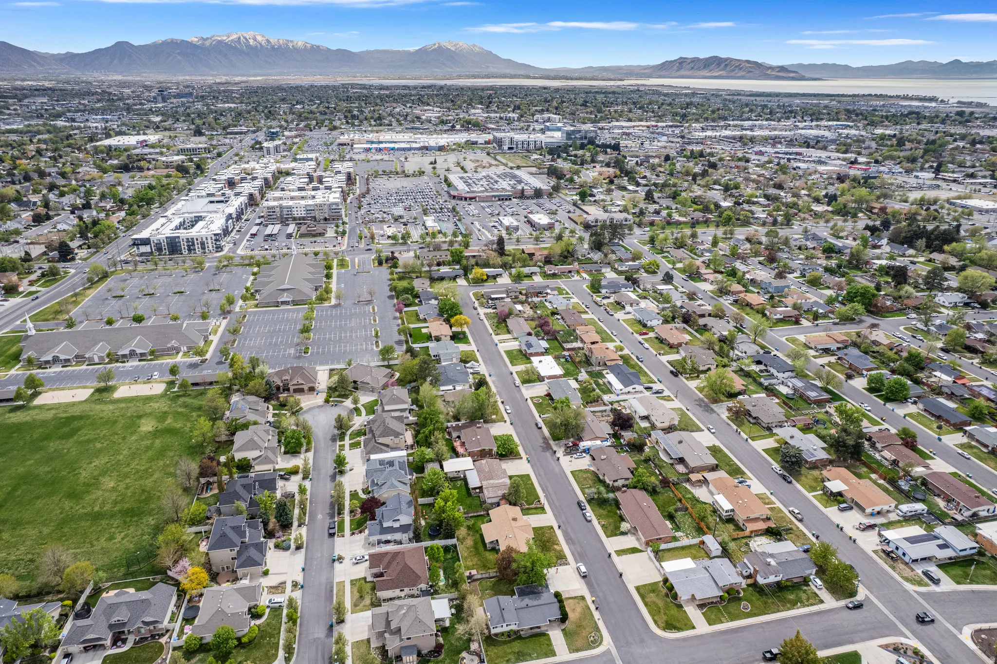 Expansive aerial perspective showcasing a residential neighborhood with varied home styles