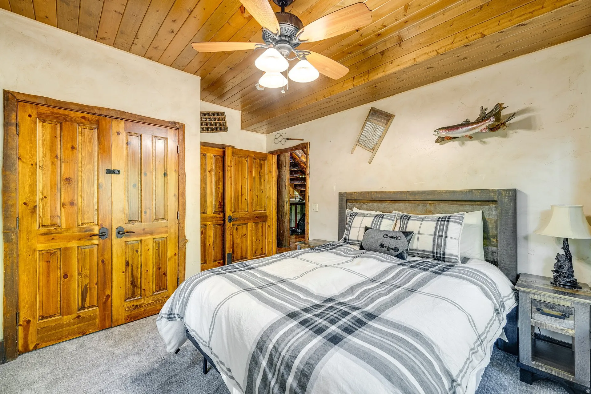 Wood-finish plank ceiling with a ceiling fan light fixture