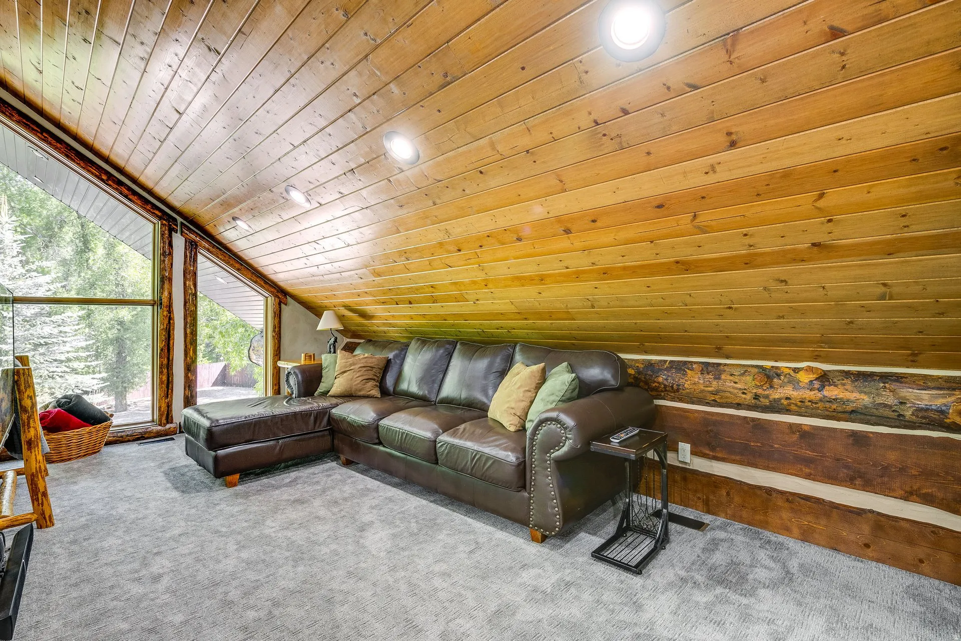 Vaulted wood-paneled ceiling with recessed lighting