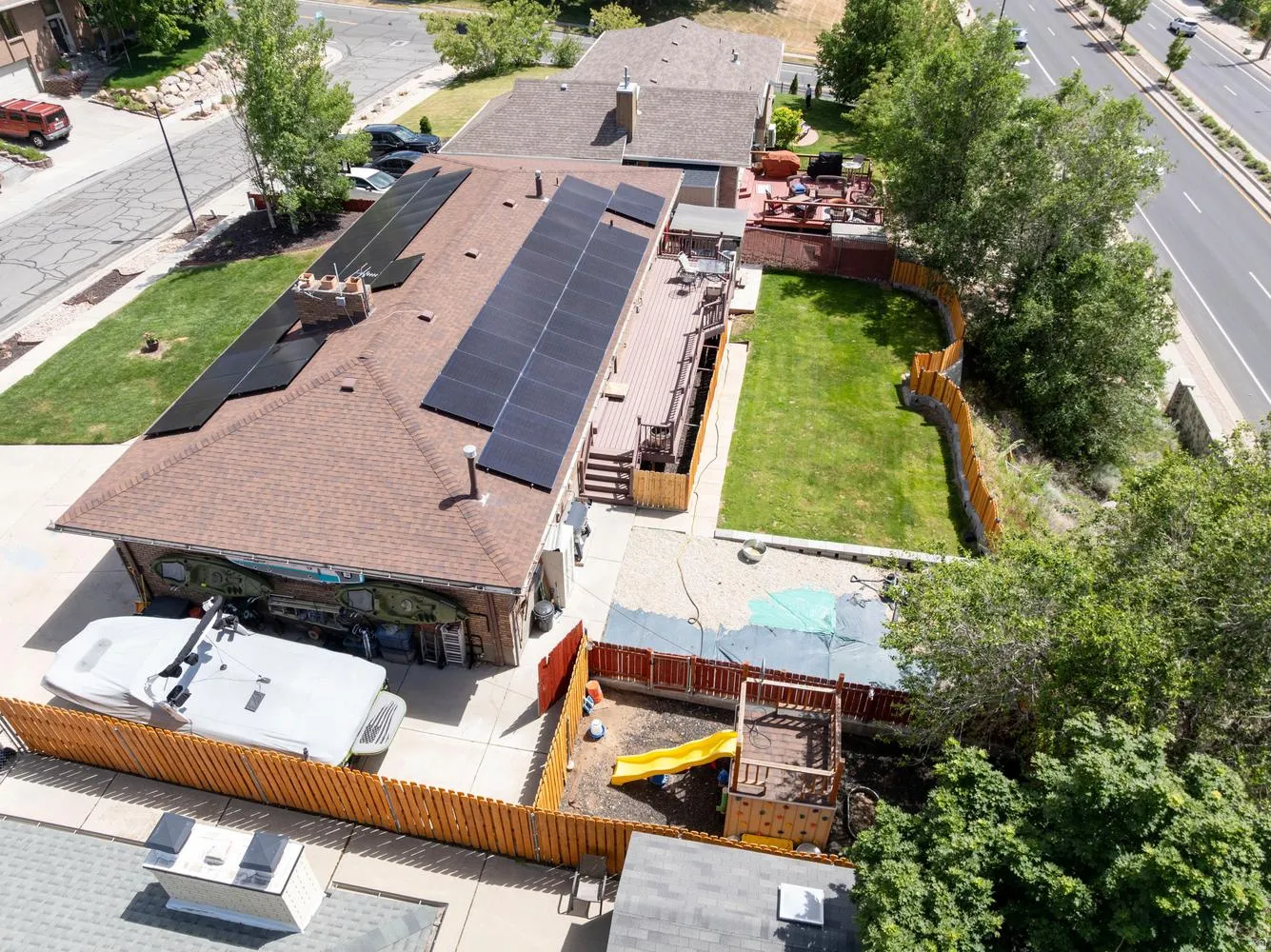 Brown shingle roof with multiple solar panels