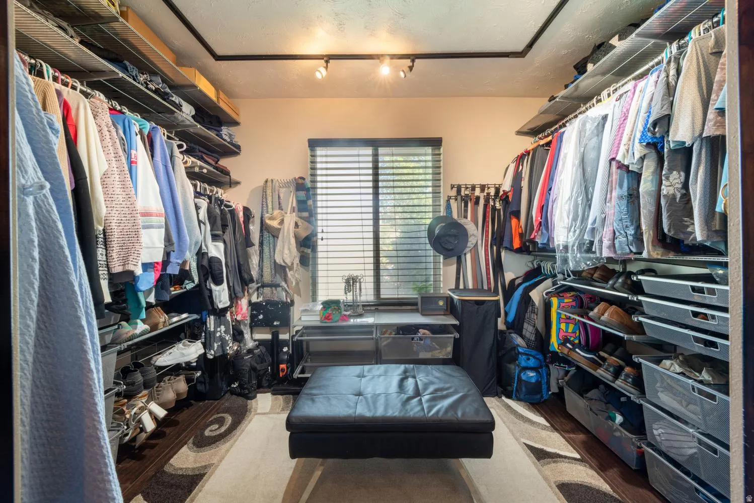 Custom-designed closet featuring extensive wire shelving and hanging rods