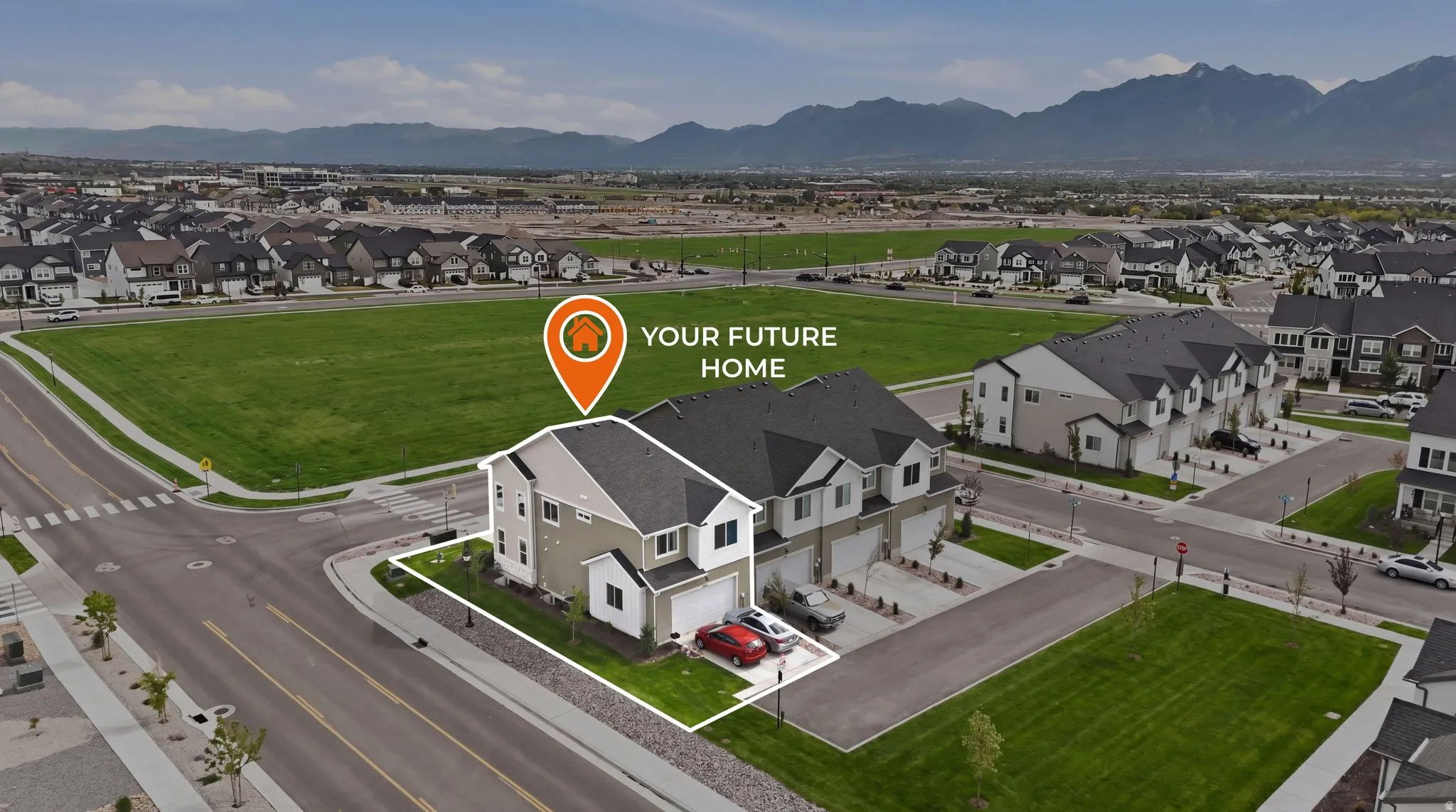 Corner lot property featuring a two-story exterior with light-toned siding, dark roof, and an attached two-car garage