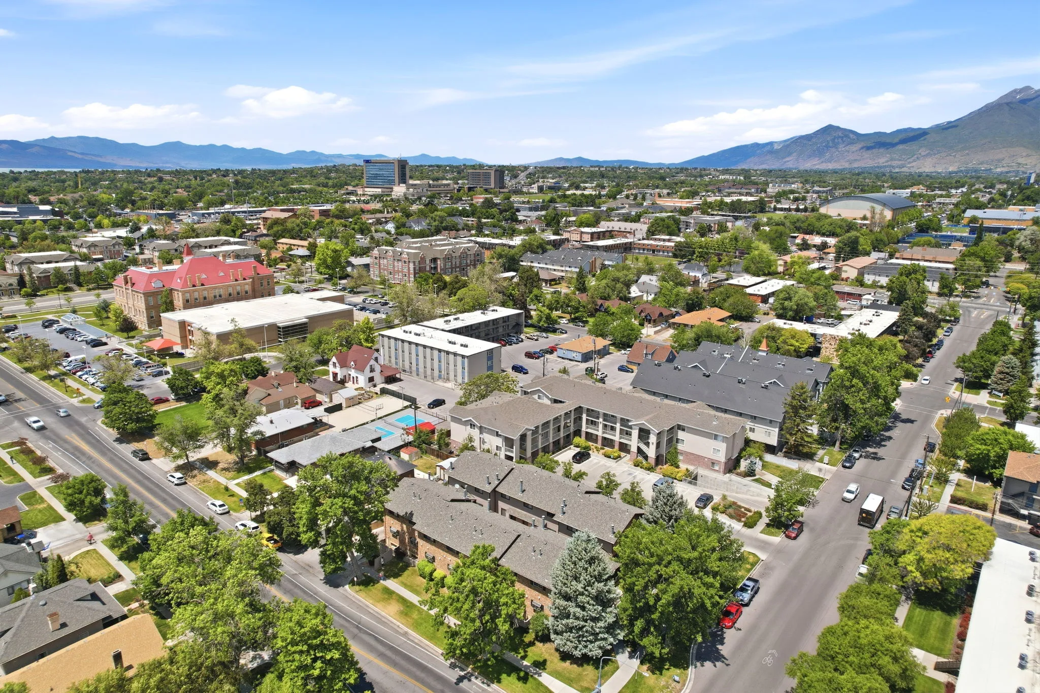 Aerial perspective showcasing a dense urban environment with a variety of residential and commercial structures