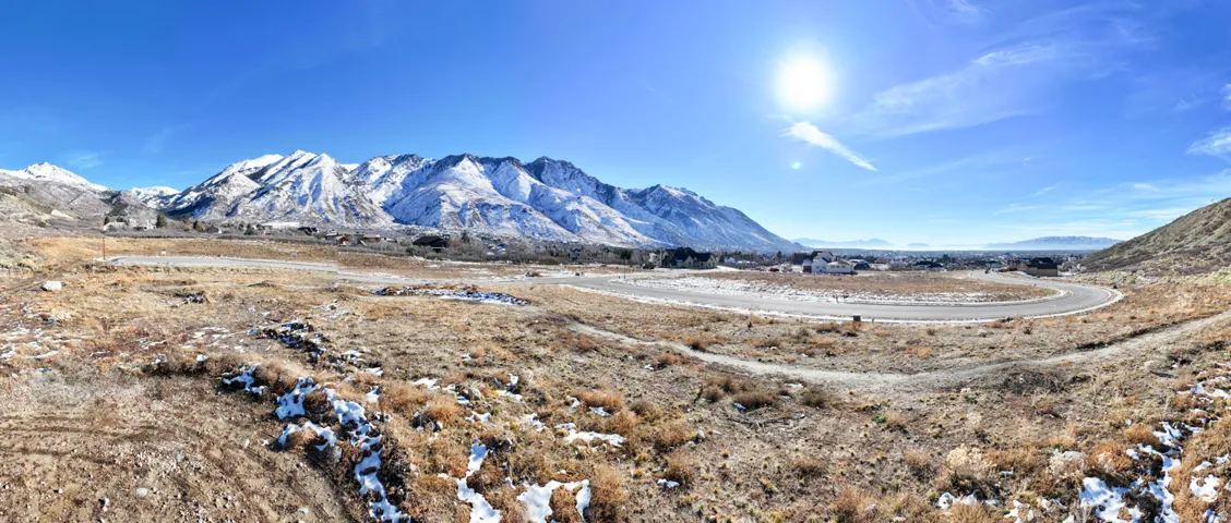 Expansive undeveloped terrain featuring a paved road