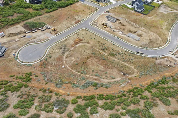 Expansive undeveloped land featuring a cul-de-sac and existing road infrastructure