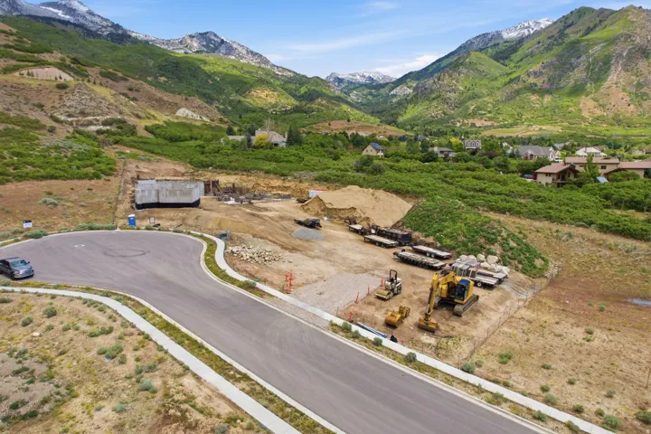 Graded lot with a partially constructed foundation, adjacent to a paved cul-de-sac