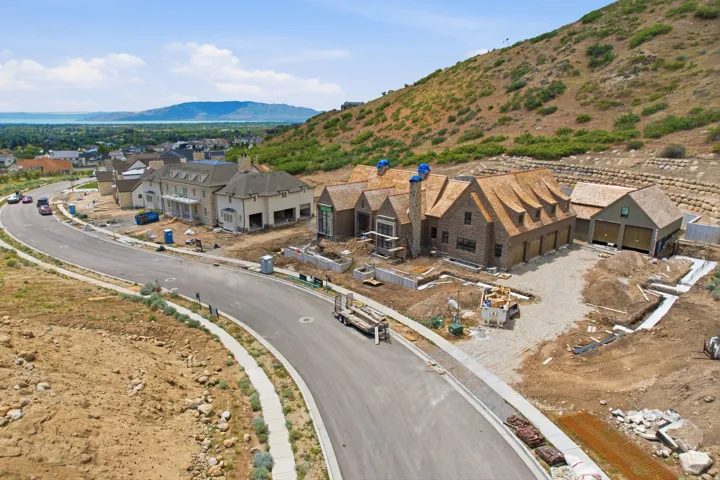 Hillside property with a brick exterior and a multi-gabled roofline