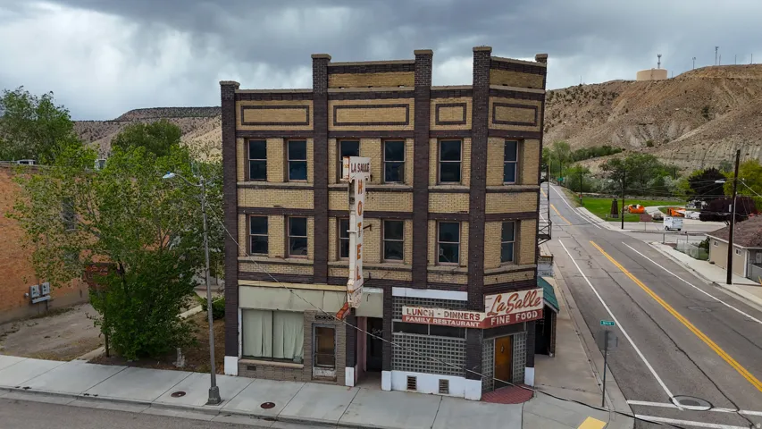 Historic brick building featuring a prominent corner entrance