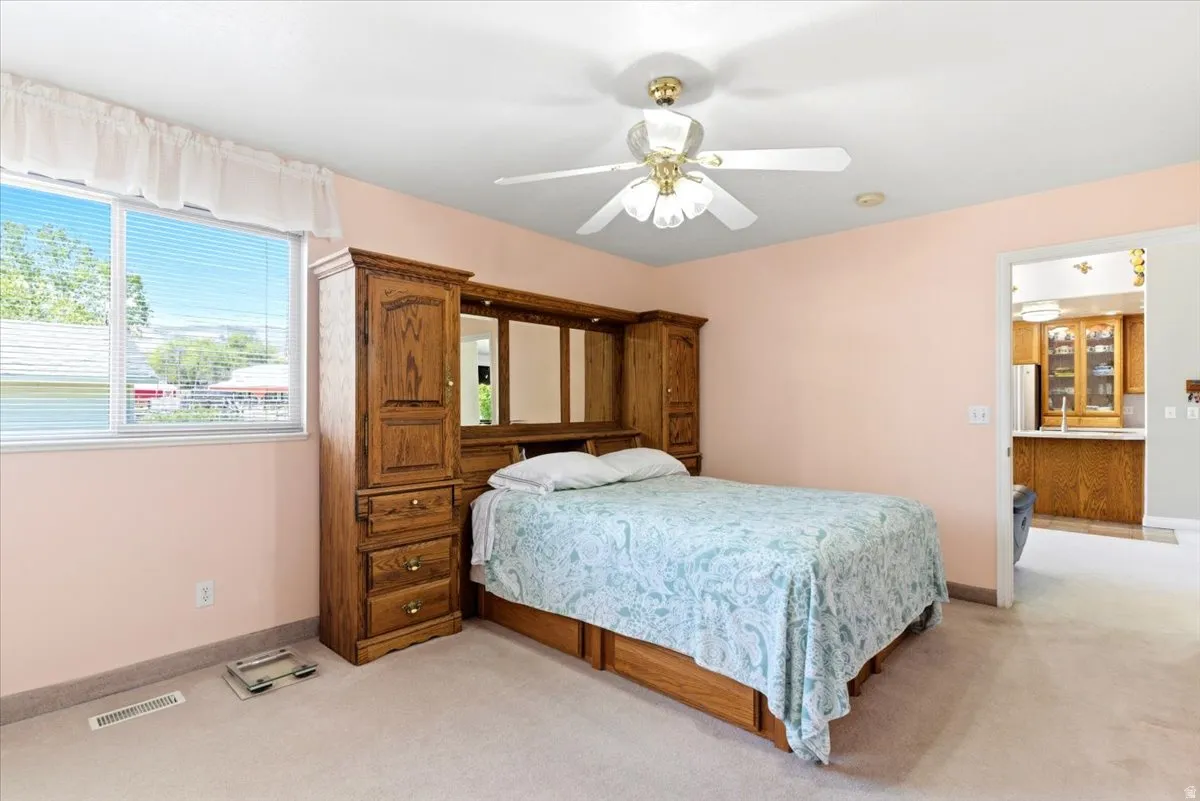 Bedroom featuring light-toned wall paint and carpet flooring