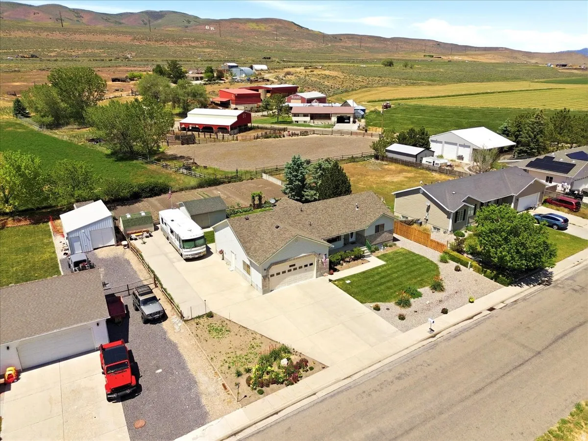 Single-story residence featuring an attached two-car garage, concrete driveway, and front lawn landscaping