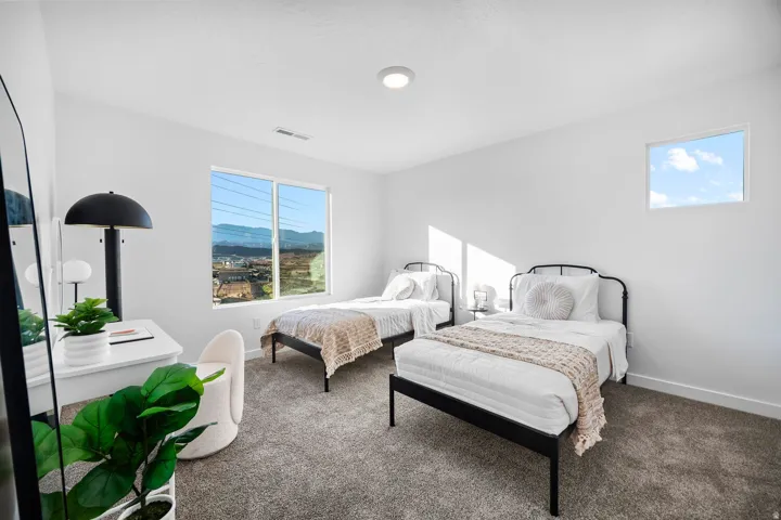 Spacious room featuring a large horizontal window and a high rectangular window