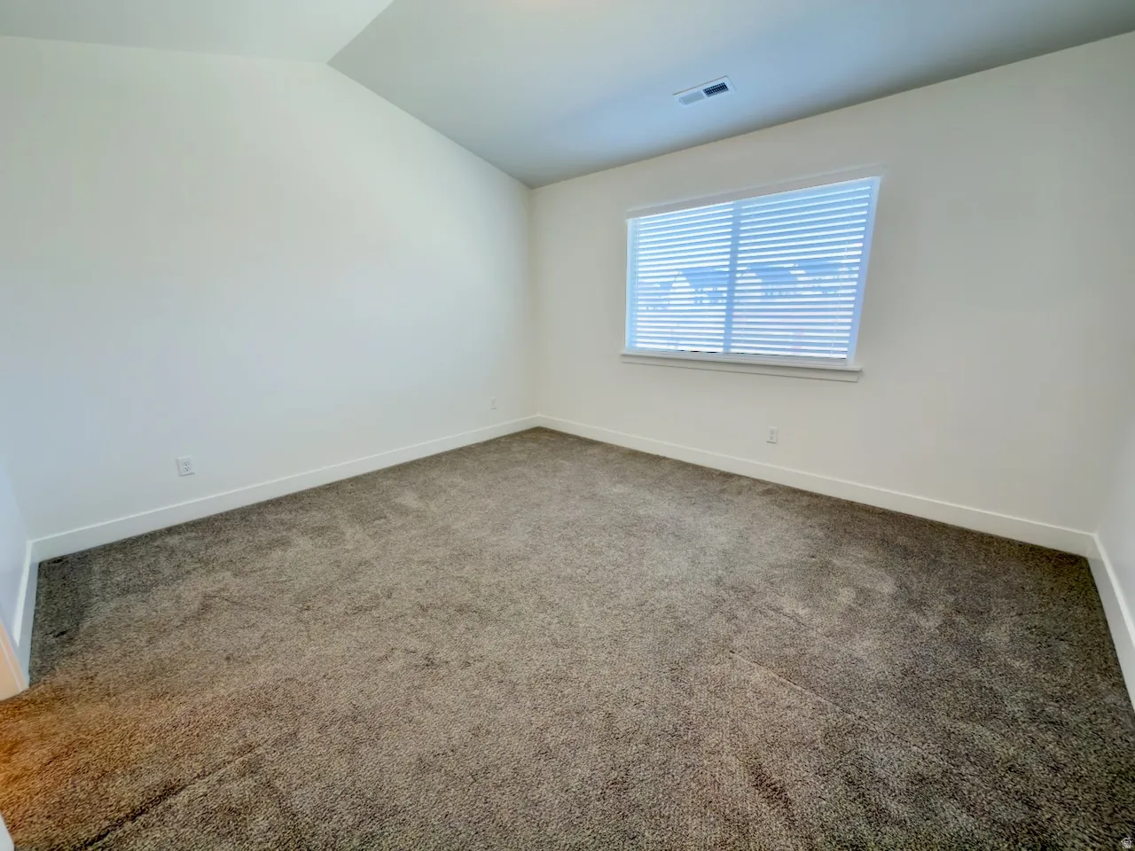 Neutral-toned carpeting paired with crisp white walls