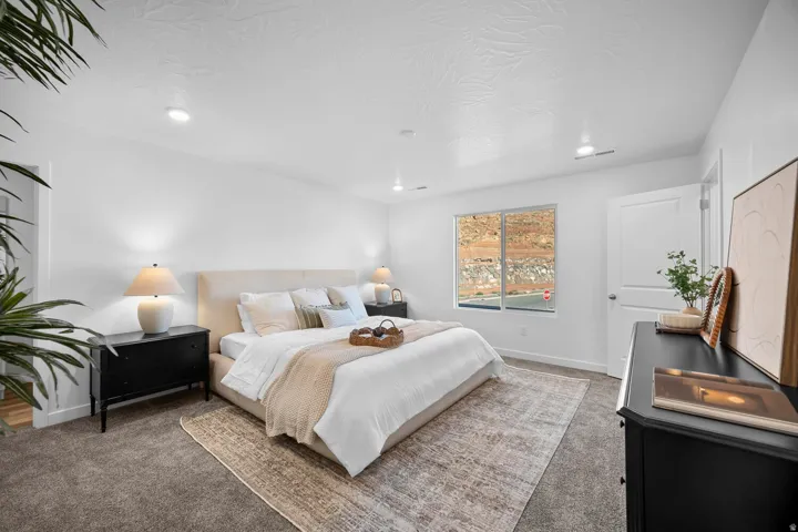 Bedroom featuring plush carpet flooring and recessed ceiling lighting