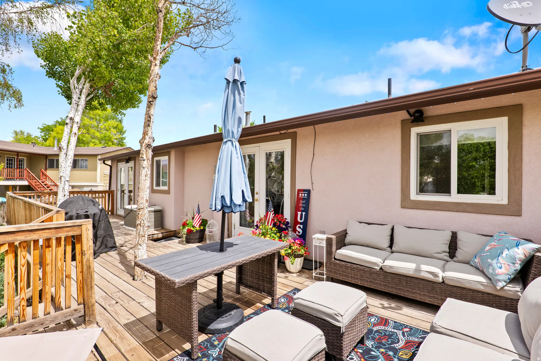 Expansive outdoor deck featuring wood flooring and a perimeter railing