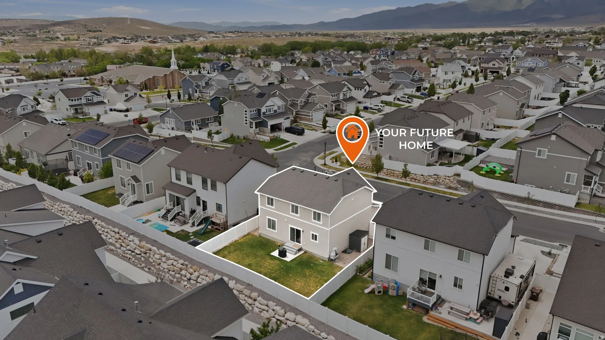 Two-story home with a fenced backyard and paved patio area