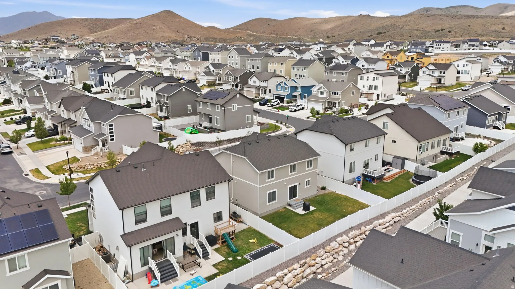Residential neighborhood featuring diverse architectural styles and natural landscaping